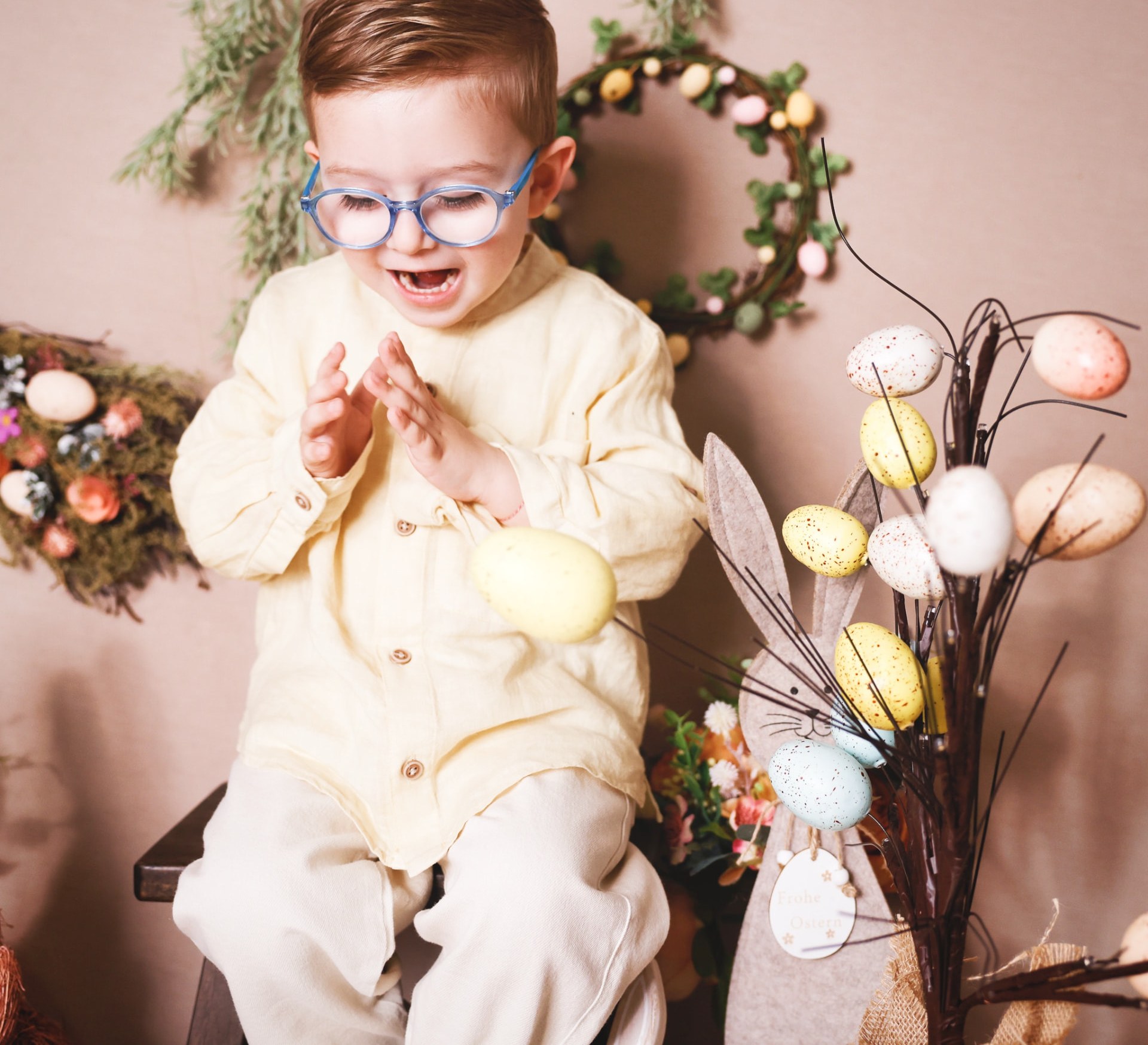 Boy laughing during a spring themed studio session