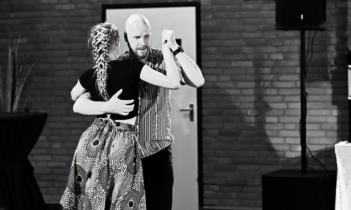 Black and white photo of a couple dancing together